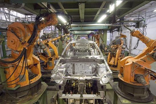KUKA industrial robots vehicle assembly line.